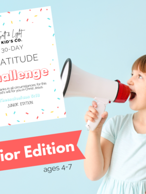 A girl holding a megaphone with the words " gratitude challenge junior edition ".